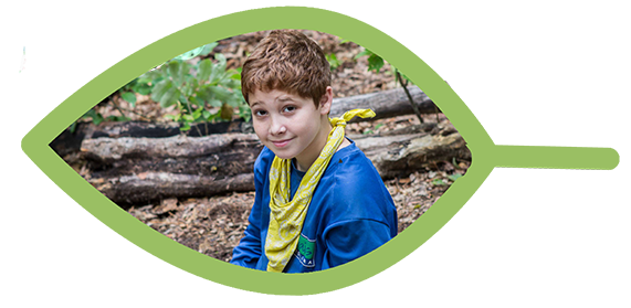 wilderness programs for youth - young boy smiling at a Trails campsite