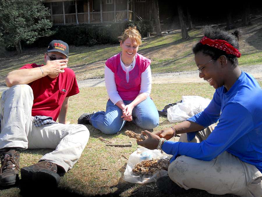 Adoptive family sits in a circle outside and engages in therapeutic activity. The impact of family involvement on at-risk youth.